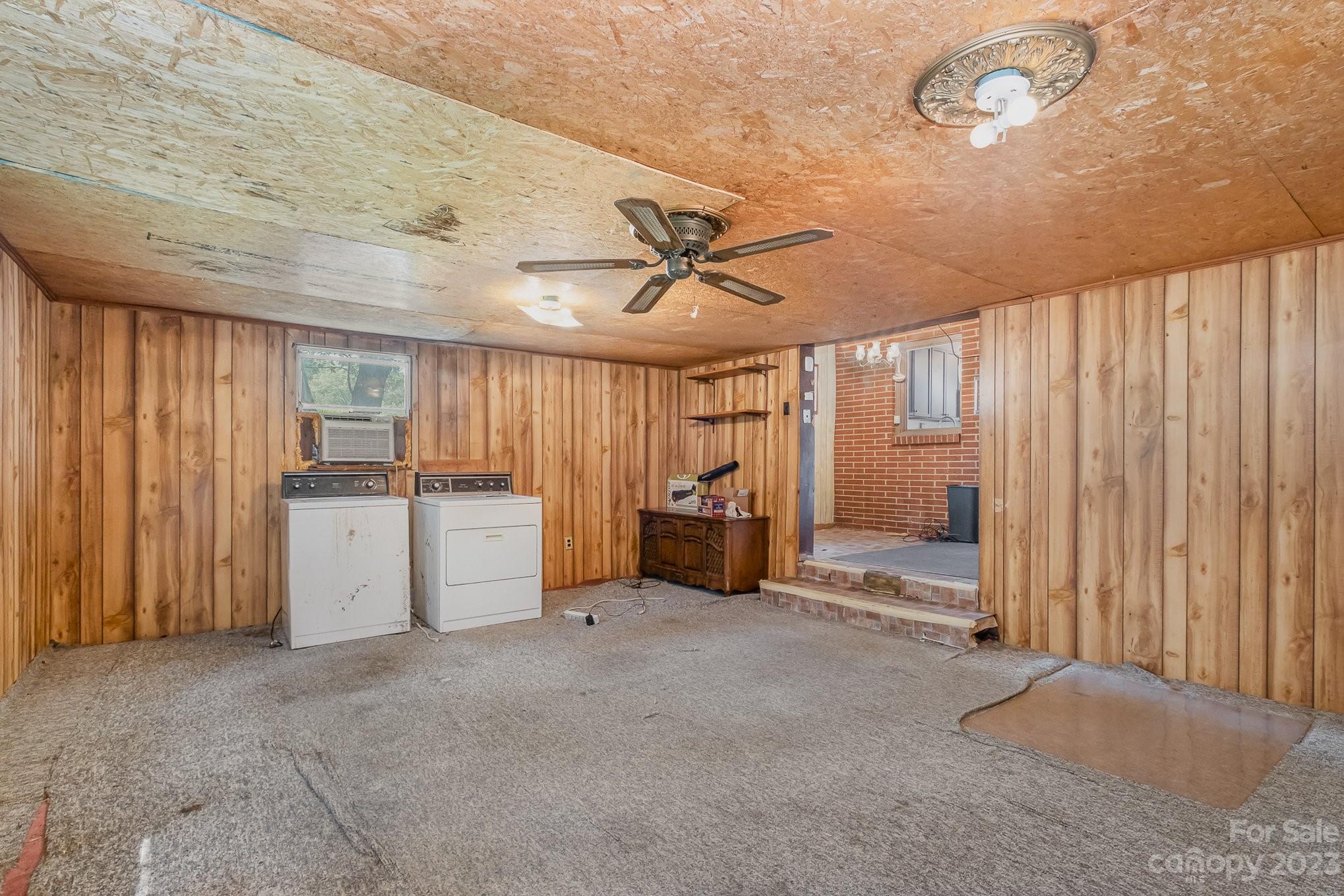 1139 Clanton Road Charlotte, NC 28217 - Photo 14 of 22 a view of a livingroom with furniture and a ceiling fan
