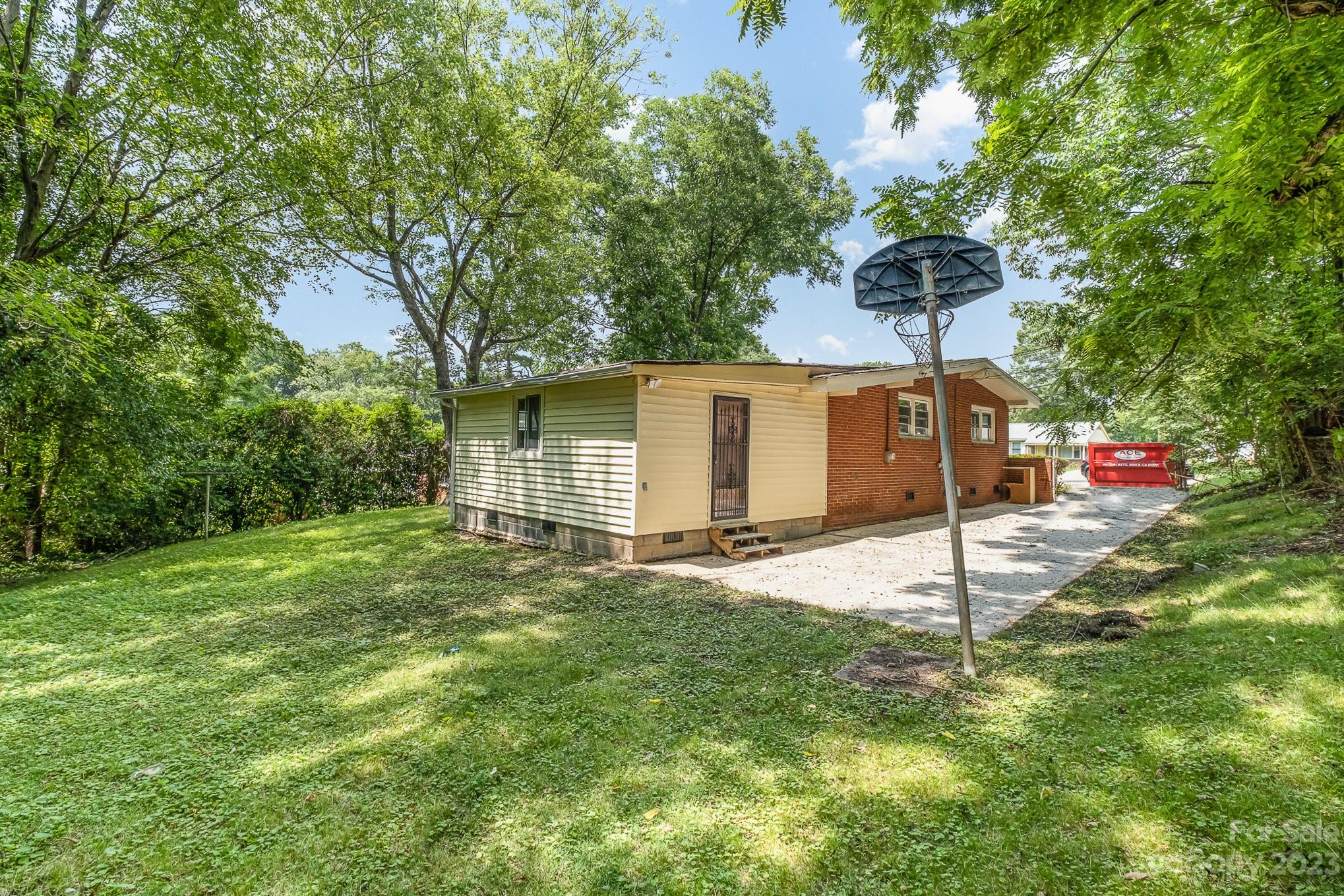 1139 Clanton Road Charlotte, NC 28217 - Photo 20 of 22 a backyard of a house with table and chairs
