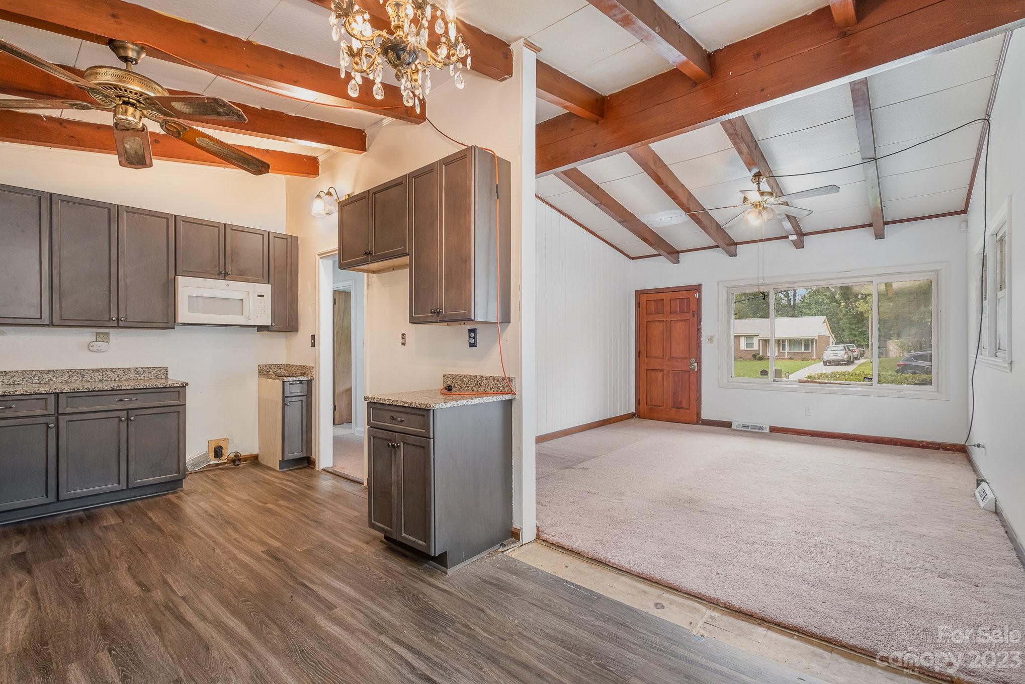 1139 Clanton Road Charlotte, NC 28217 - Photo 6 of 22 a view of living room with furniture and flat screen tv