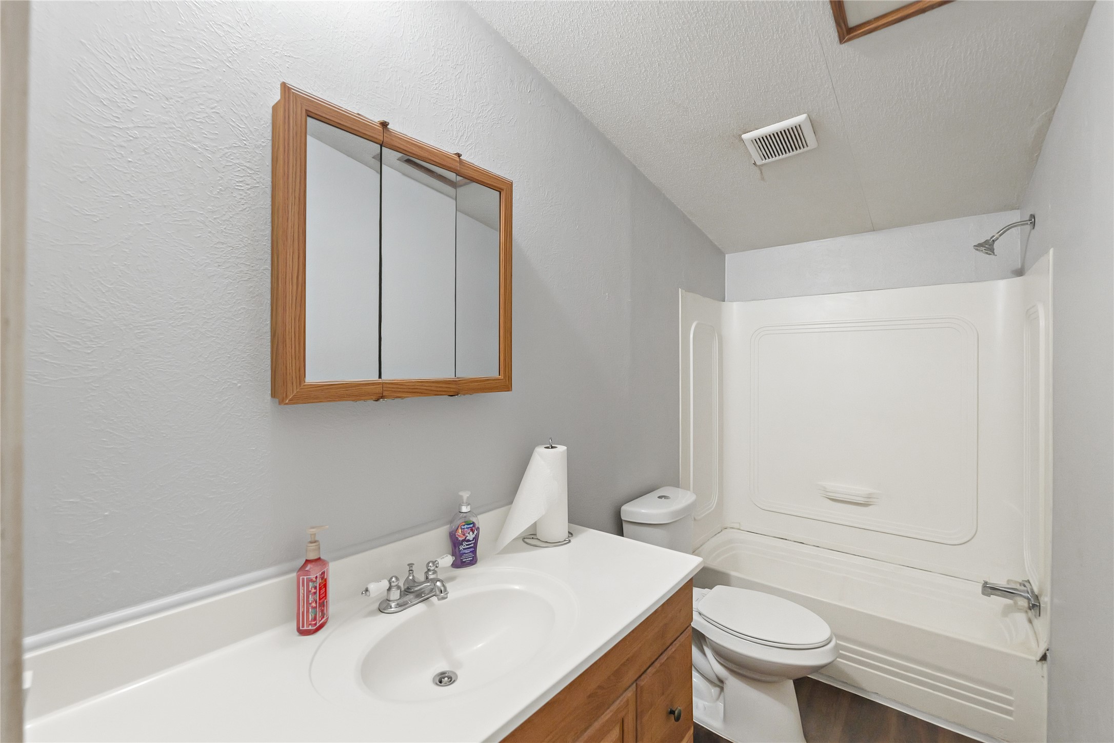 16572 River Ranch Drive Conroe, TX 77302 - Photo 14 of 24 a bathroom with a sink toilet and vanity