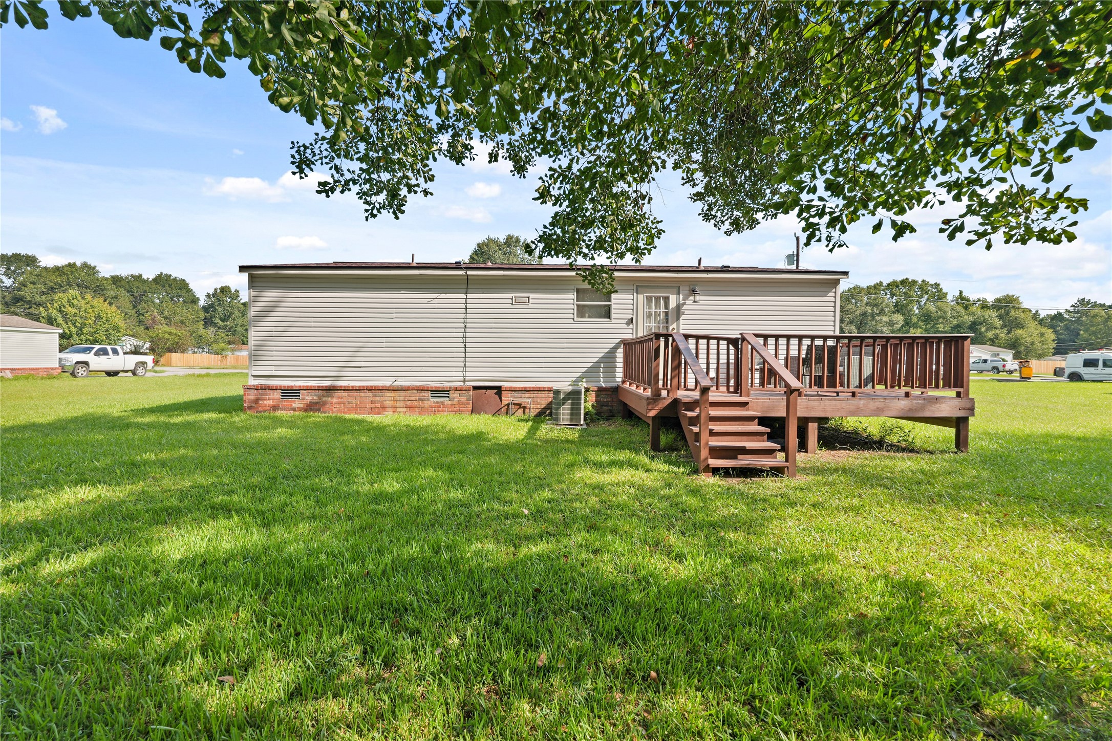 16572 River Ranch Drive Conroe, TX 77302 - Photo 20 of 24 a view of a house with backyard and sitting area