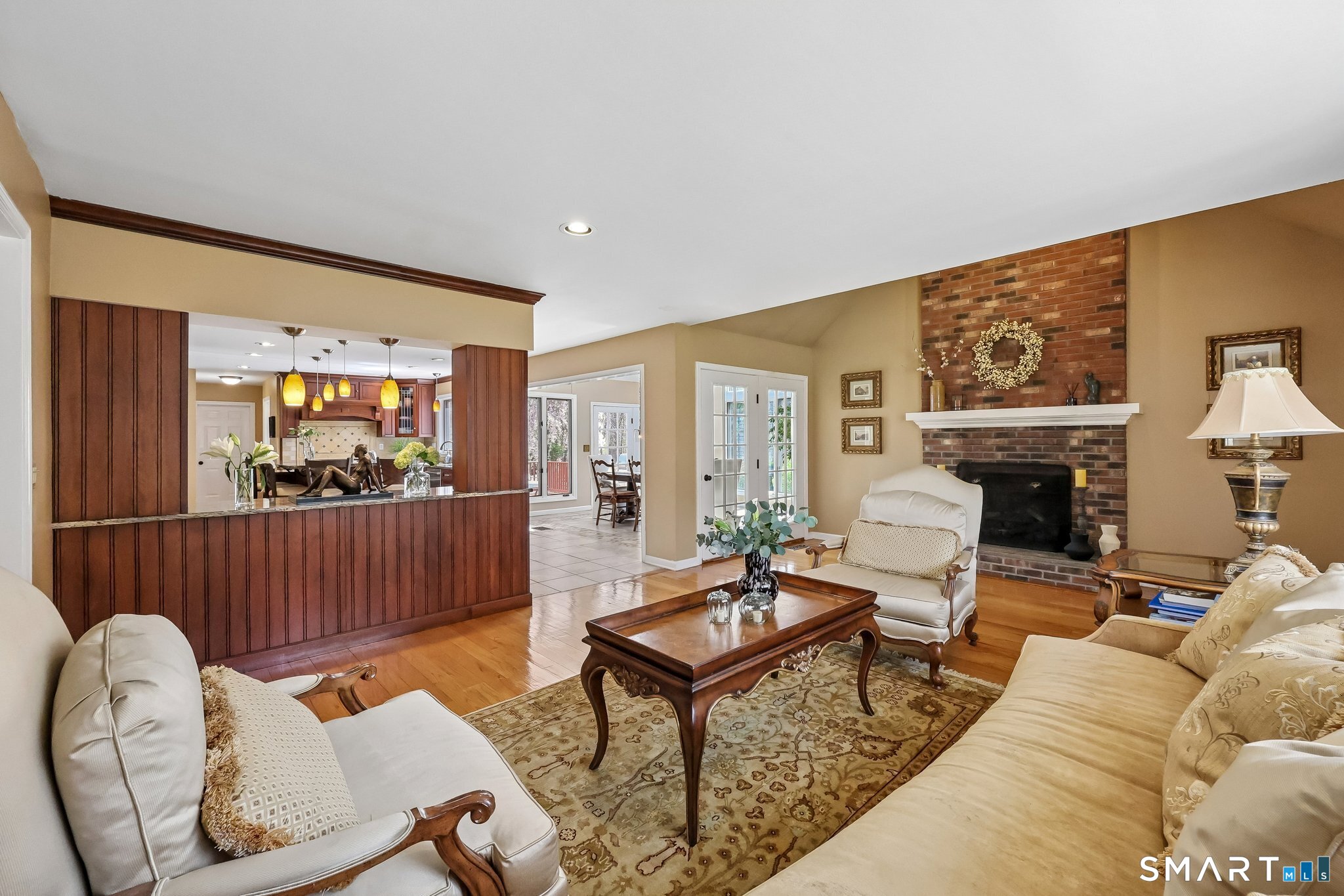 86 Quail Run Madison, CT 06443 - Photo 11 of 37 The family room flows to the kitchen and large year-round sunroom