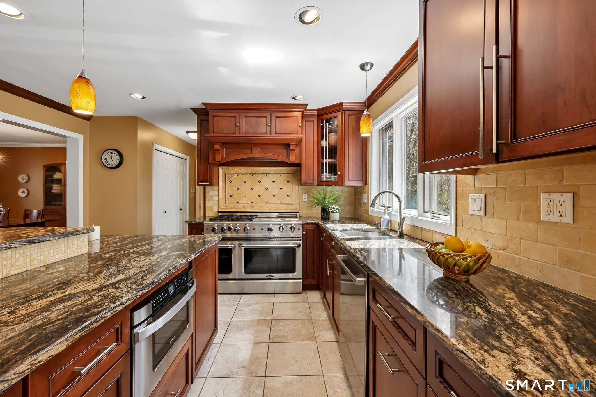 86 Quail Run Madison, CT 06443 - Photo 13 of 37 Upscale stainless steel appliances include a SubZero refrigerator and a Capital Cooktop with two ovens. There's even a grill area! The subway tile backsplash, decorative tile above the stove and gorgeous granite are beautiful