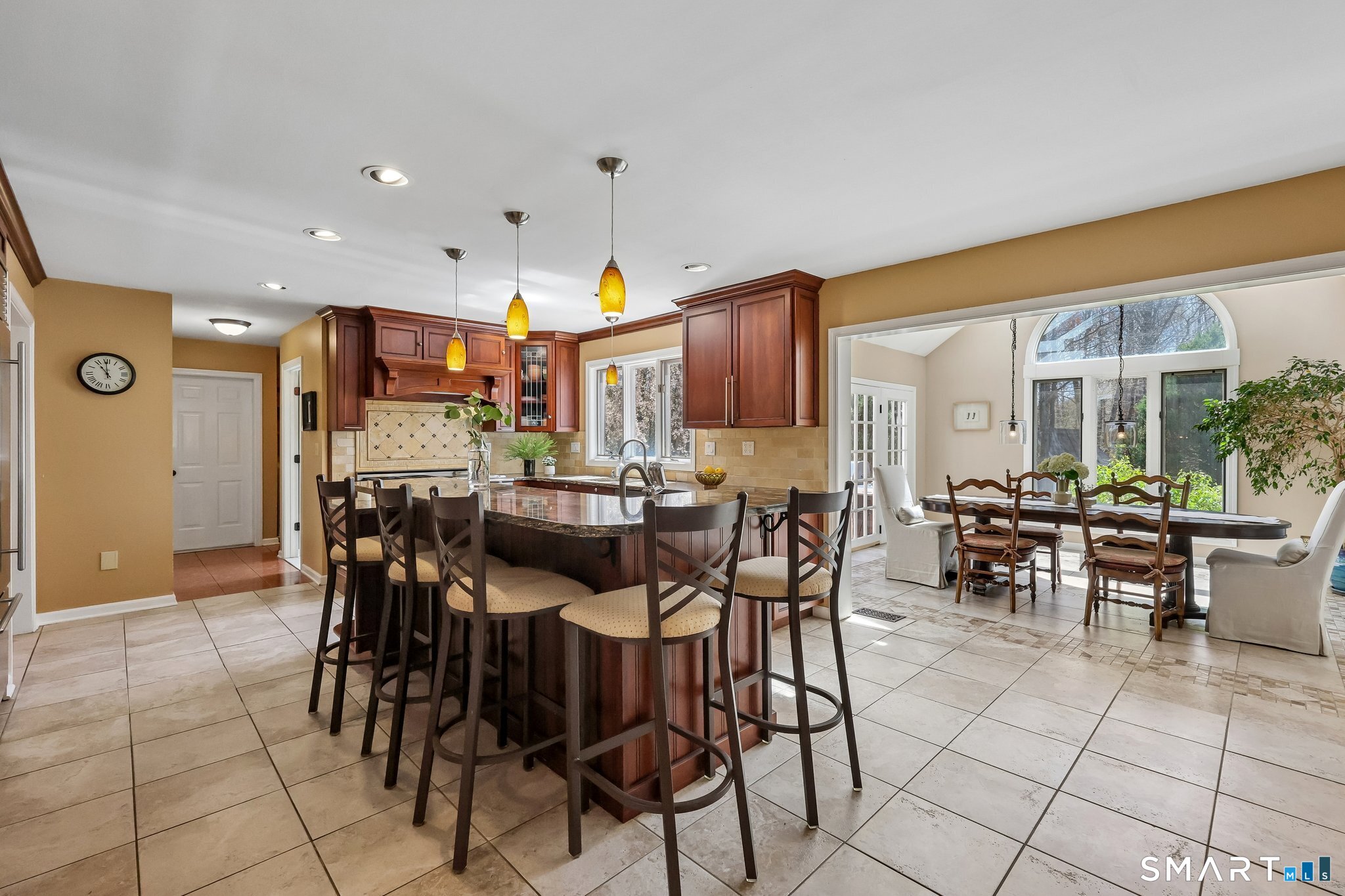 86 Quail Run Madison, CT 06443 - Photo 14 of 37 The center island has lots of seating and a second sink. It's a great extra prep area if you have multiple cooks in the kitchen