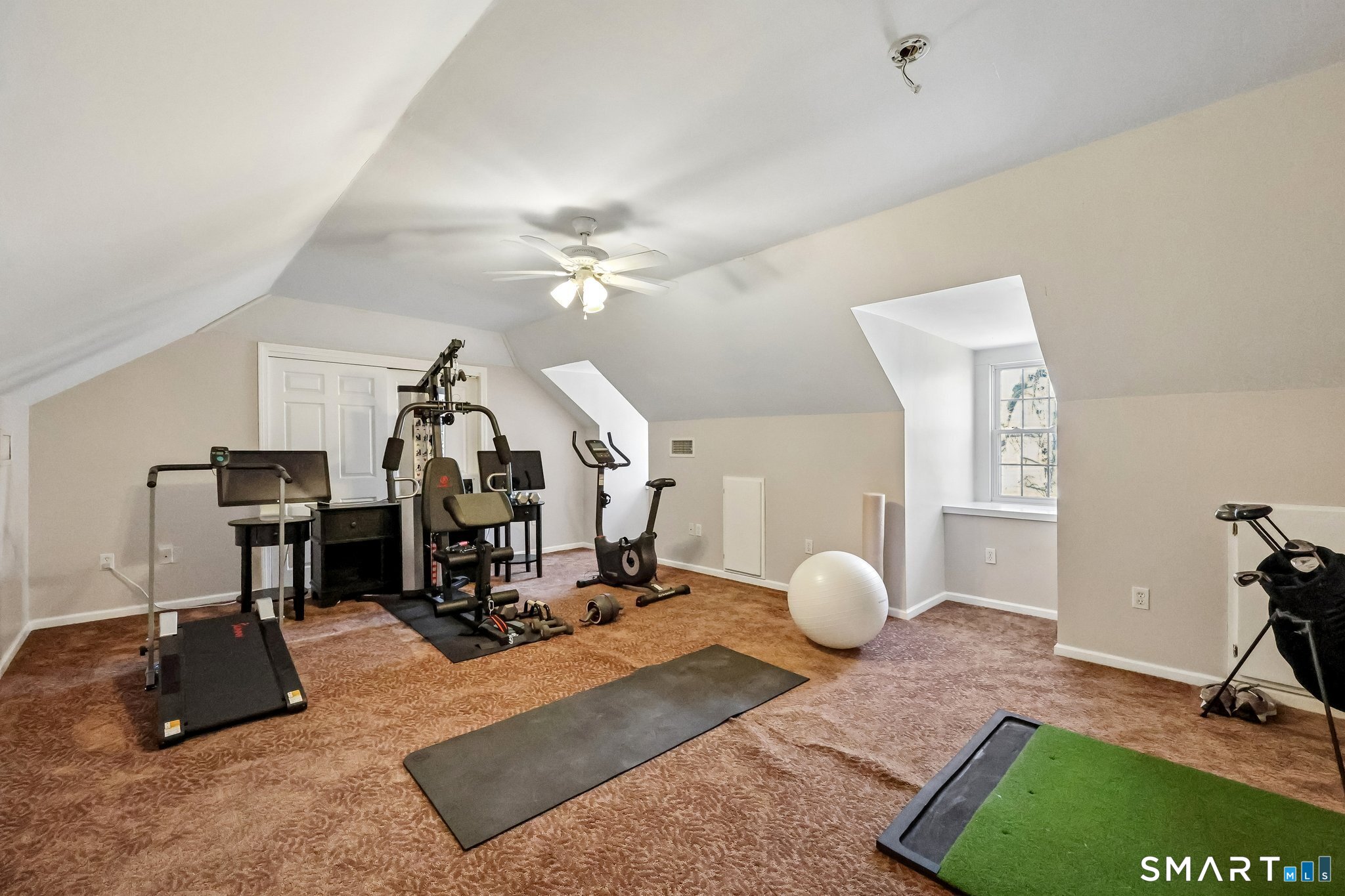 86 Quail Run Madison, CT 06443 - Photo 29 of 37 The larger of the two rooms on the third floor is used as a workout space. There's a large closet for storage too