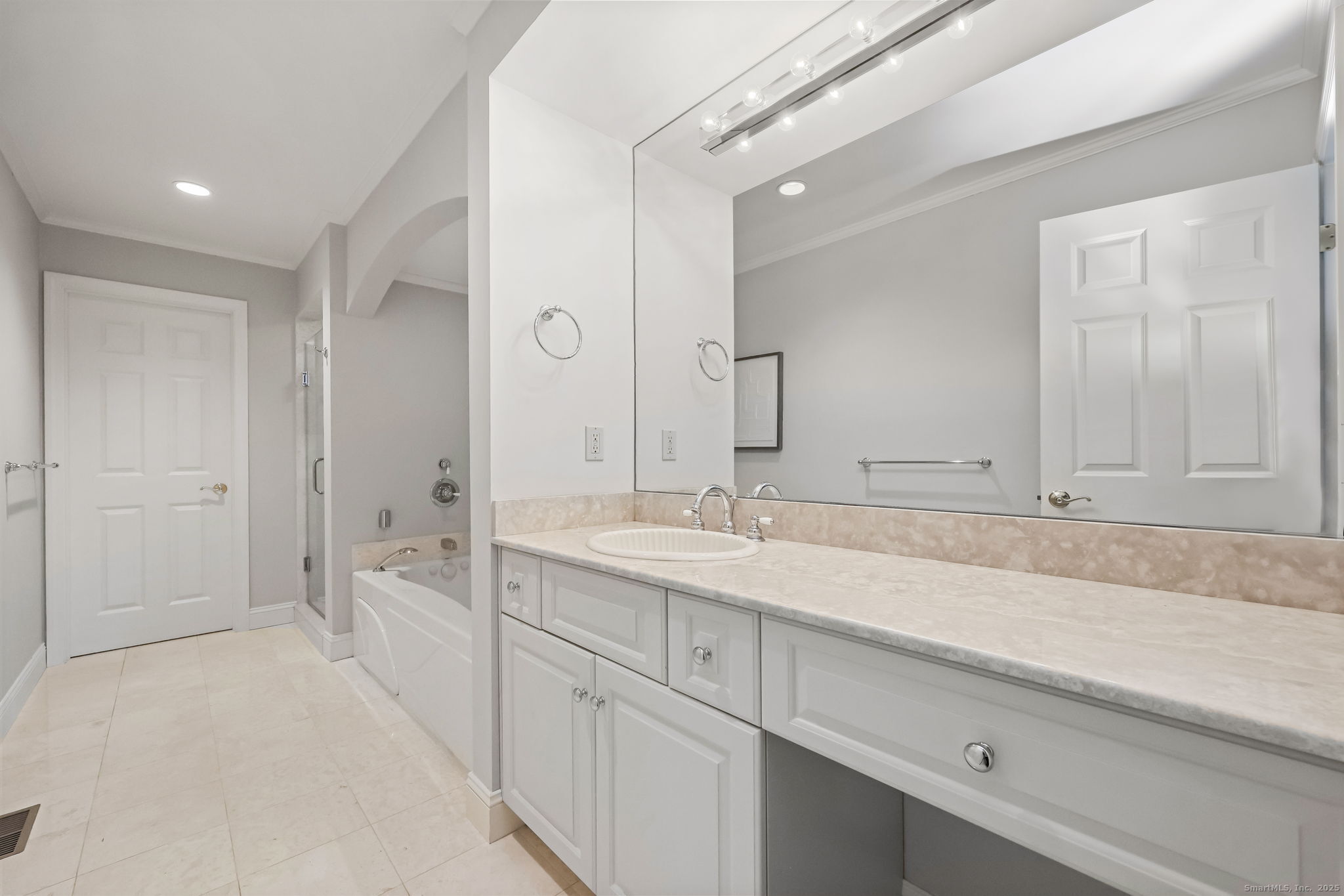 76 Hilary Circle, Unit 76 Fairfield, CT 06825 - Photo 18 of 29 a bathroom with a sink and a mirror