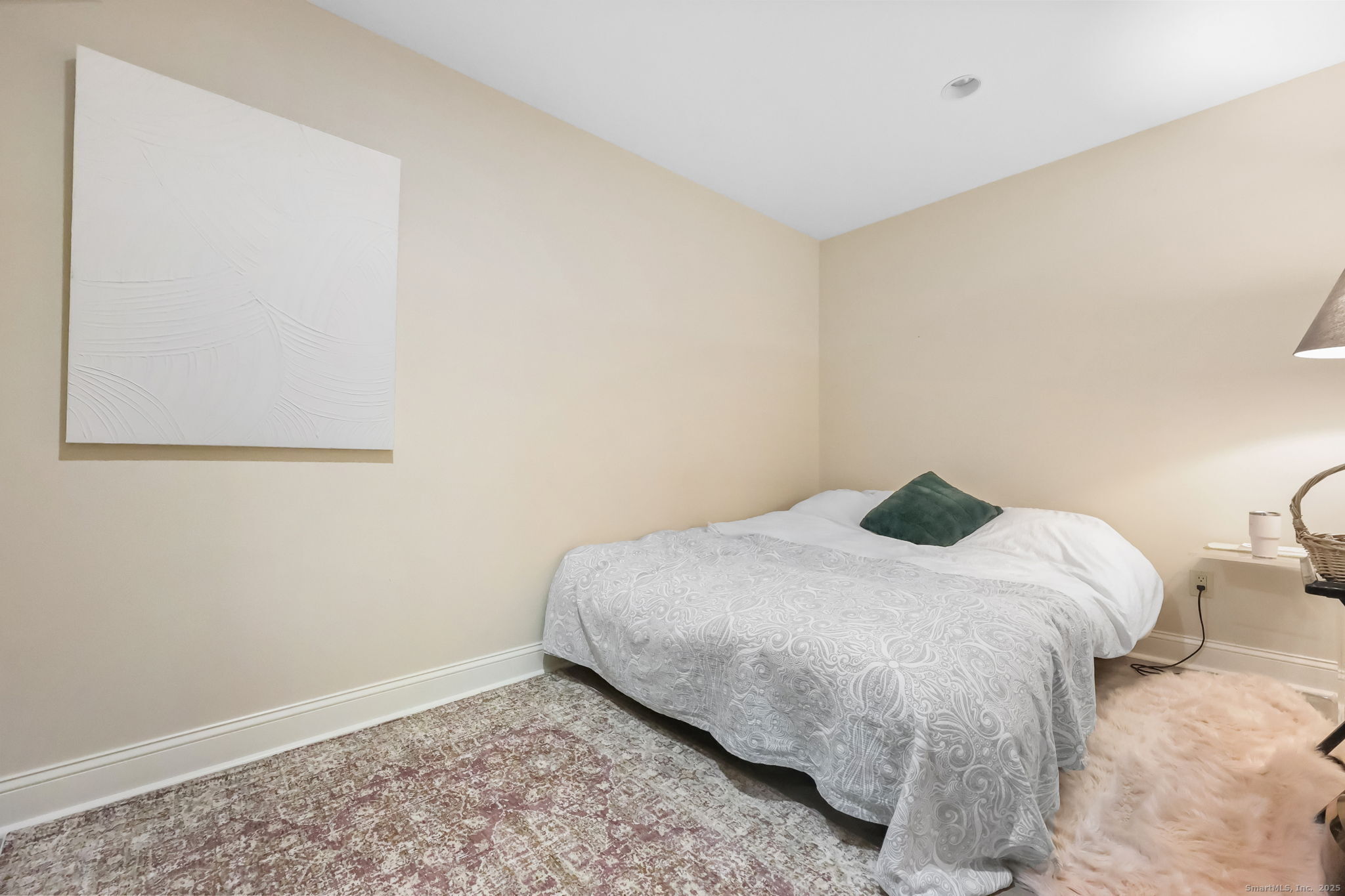 76 Hilary Circle, Unit 76 Fairfield, CT 06825 - Photo 20 of 29 a bedroom with a bed and a window