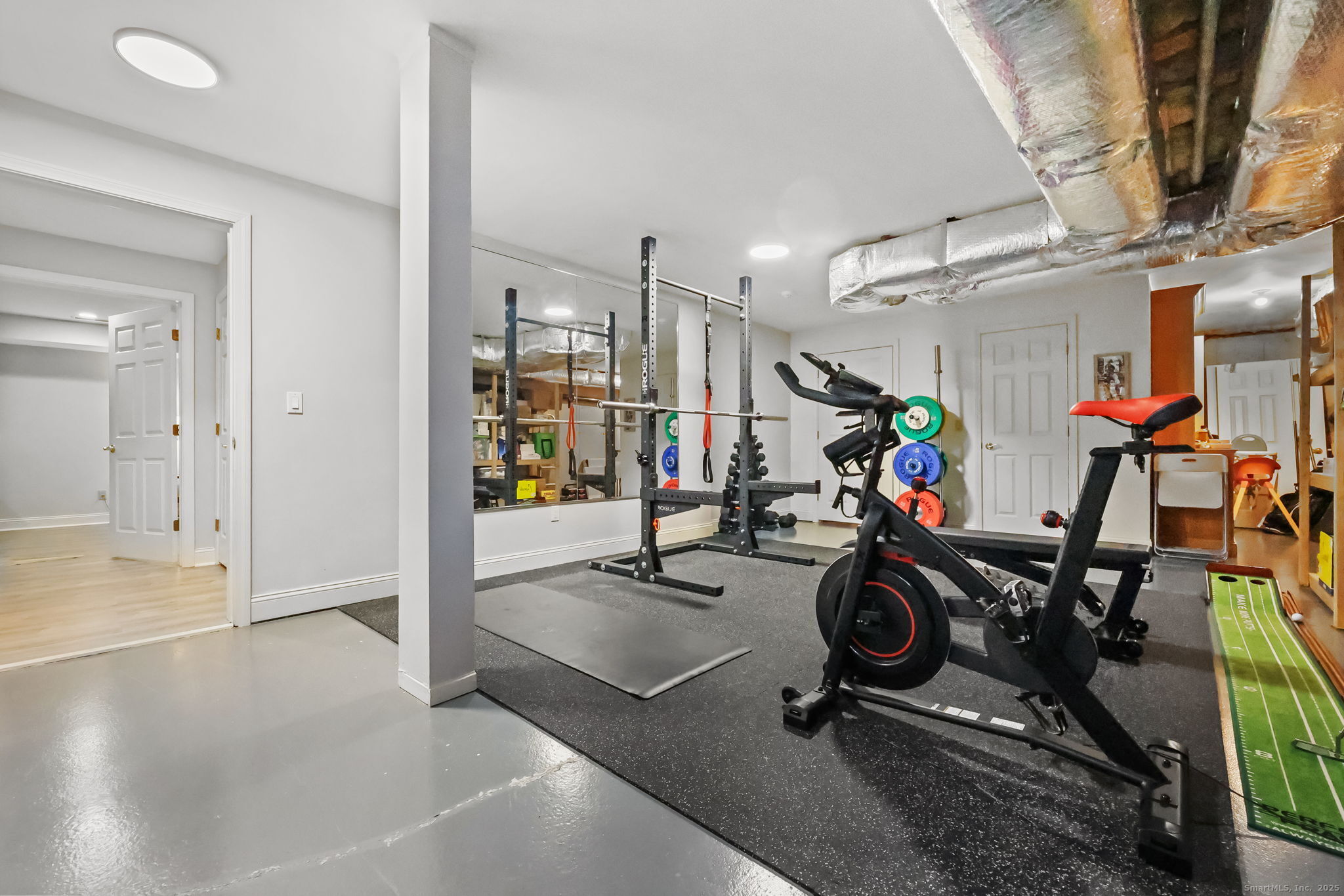 76 Hilary Circle, Unit 76 Fairfield, CT 06825 - Photo 21 of 29 a view of a room with gym equipment