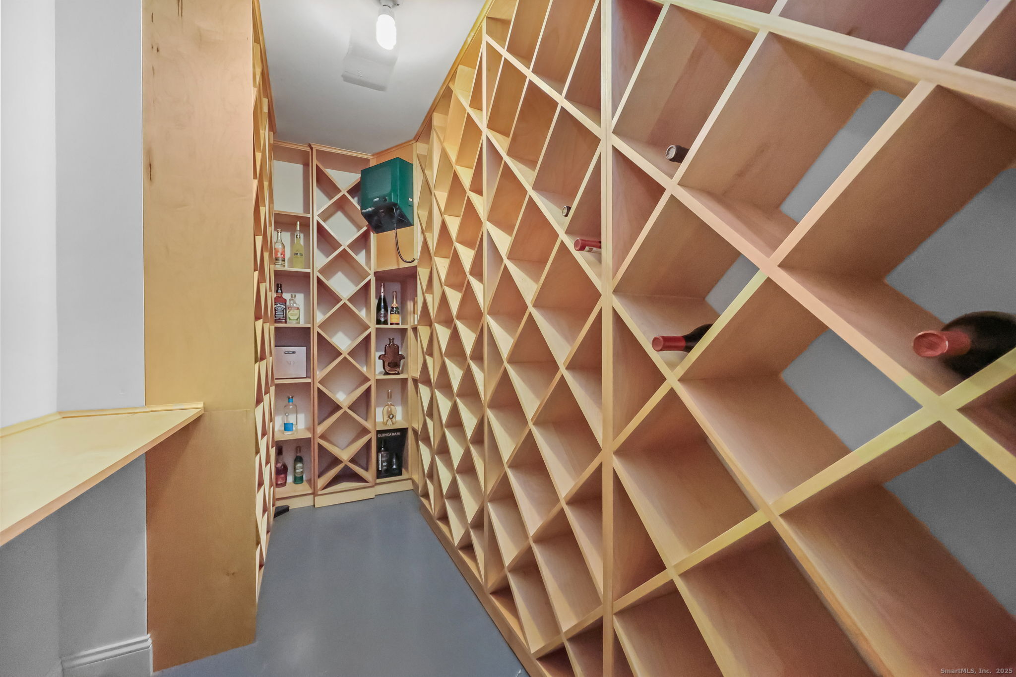 76 Hilary Circle, Unit 76 Fairfield, CT 06825 - Photo 22 of 29 a view of an empty room with wooden floor and a shower