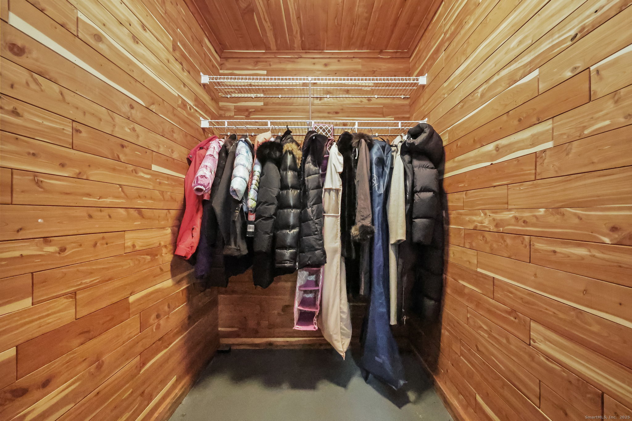 76 Hilary Circle, Unit 76 Fairfield, CT 06825 - Photo 23 of 29 a view of walk in closet with clothes