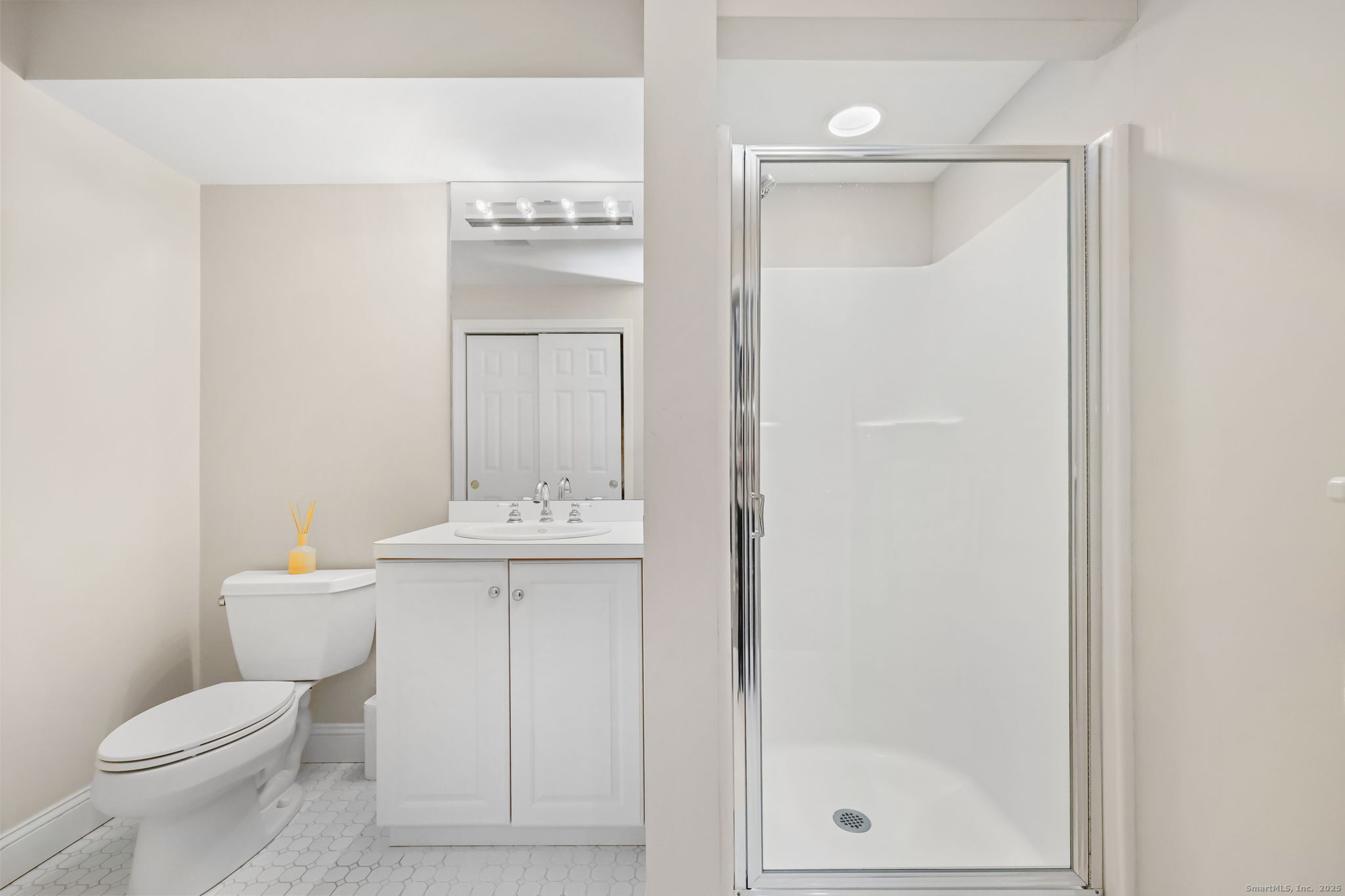 76 Hilary Circle, Unit 76 Fairfield, CT 06825 - Photo 24 of 29 a bathroom with a toilet a sink and shower