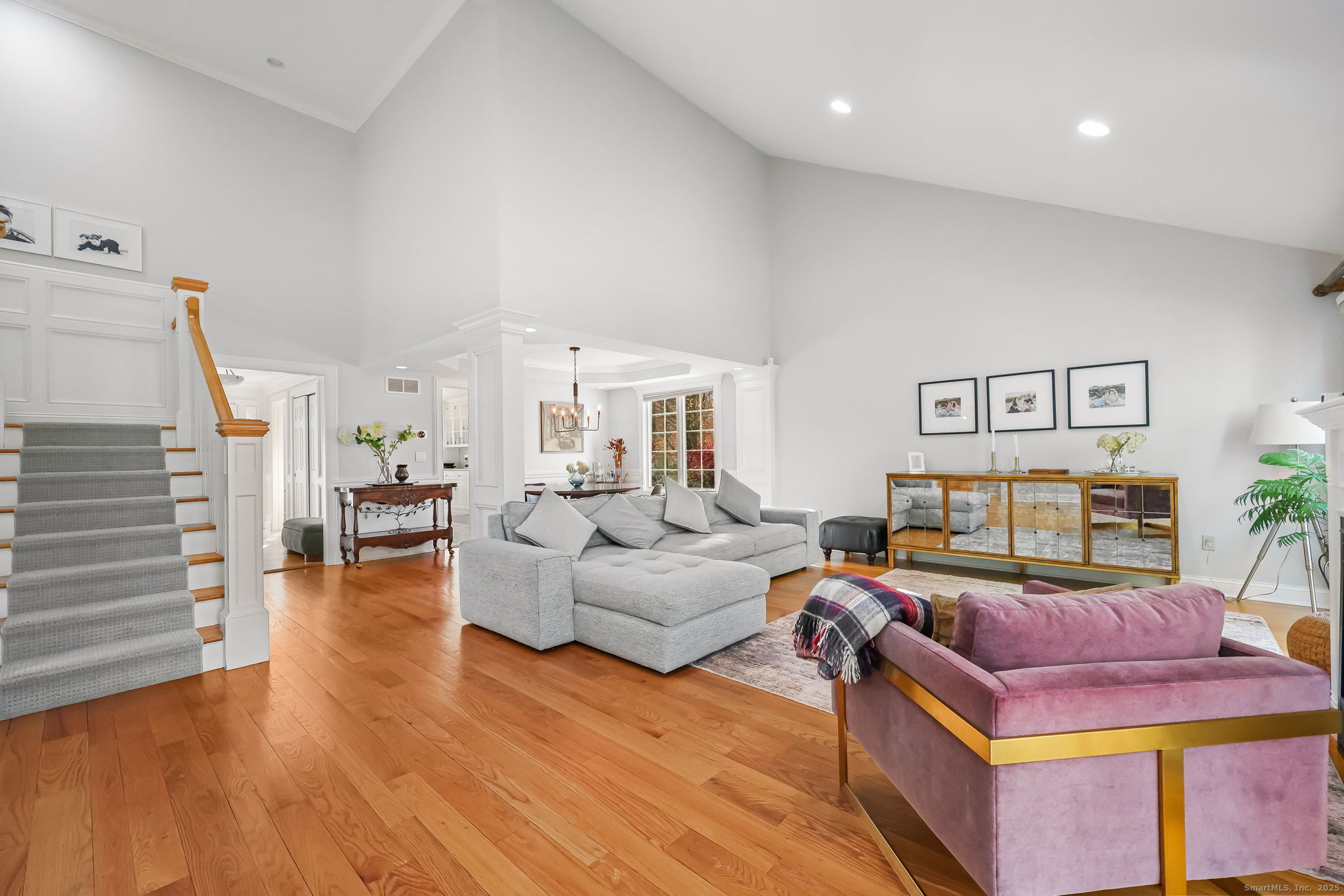 76 Hilary Circle, Unit 76 Fairfield, CT 06825 - Photo 5 of 29 a living room with furniture and wooden floor