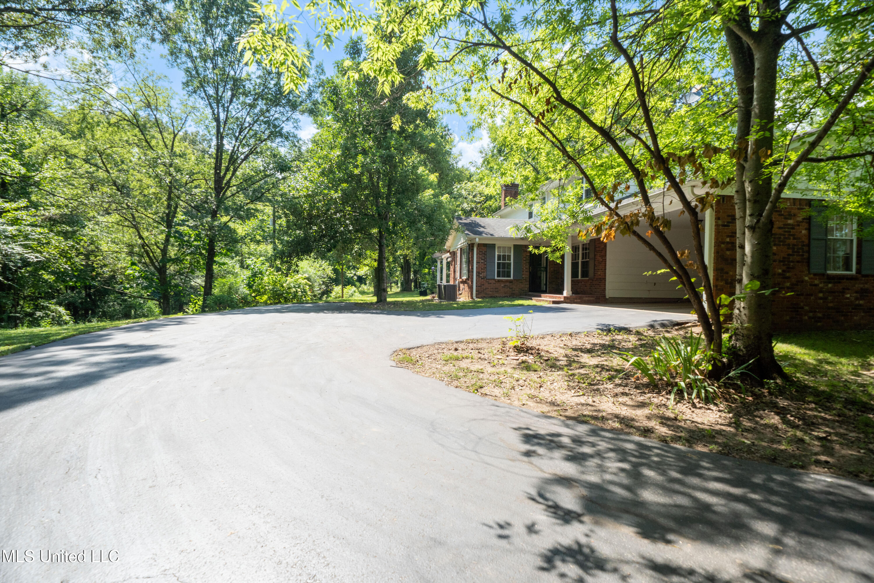 6333 Church Road Walls, MS 38680 - Photo 41 of 44 Rear entry carport and parking