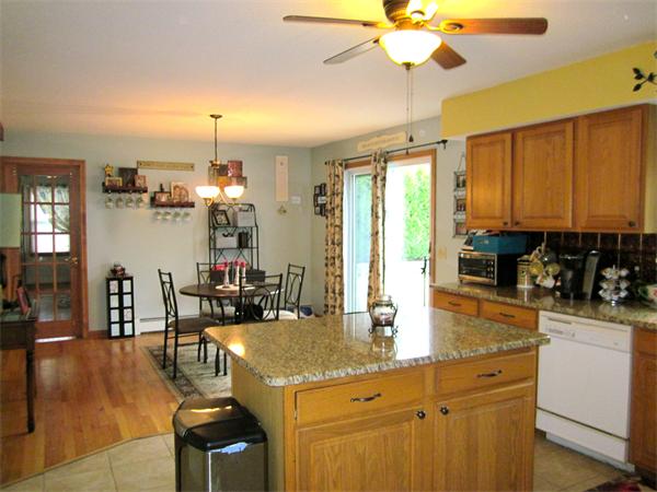 36 Strong Road Southampton, MA 01073 - Photo 6 of 20 a kitchen with a table chairs stove and cabinets