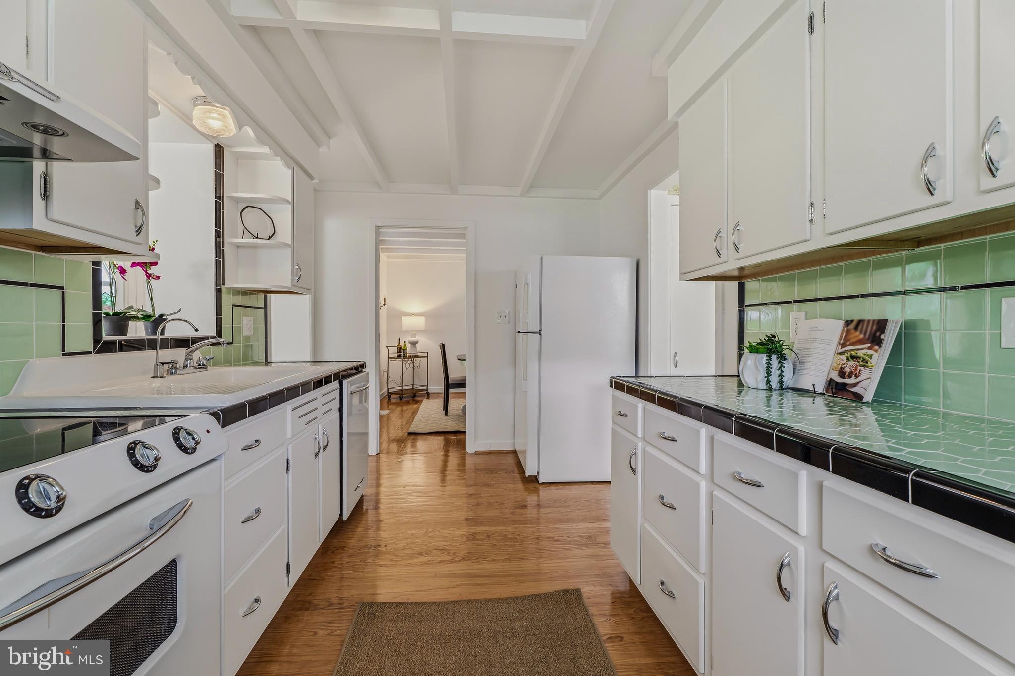 2425 Albert Rill Road Hampstead, MD 21074 - Photo 11 of 44 a large white kitchen with stainless steel appliances granite countertop a lot of counter space and a sink