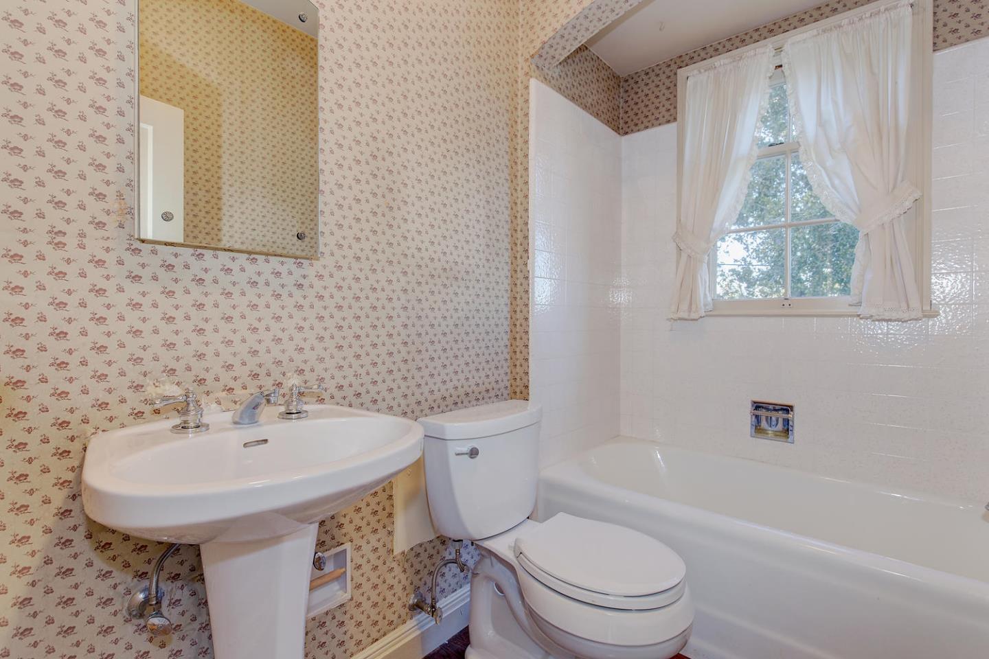 540 Roehampton Road Hillsborough, CA 94010 - Photo 17 of 27 a bathroom with a sink a toilet and shower