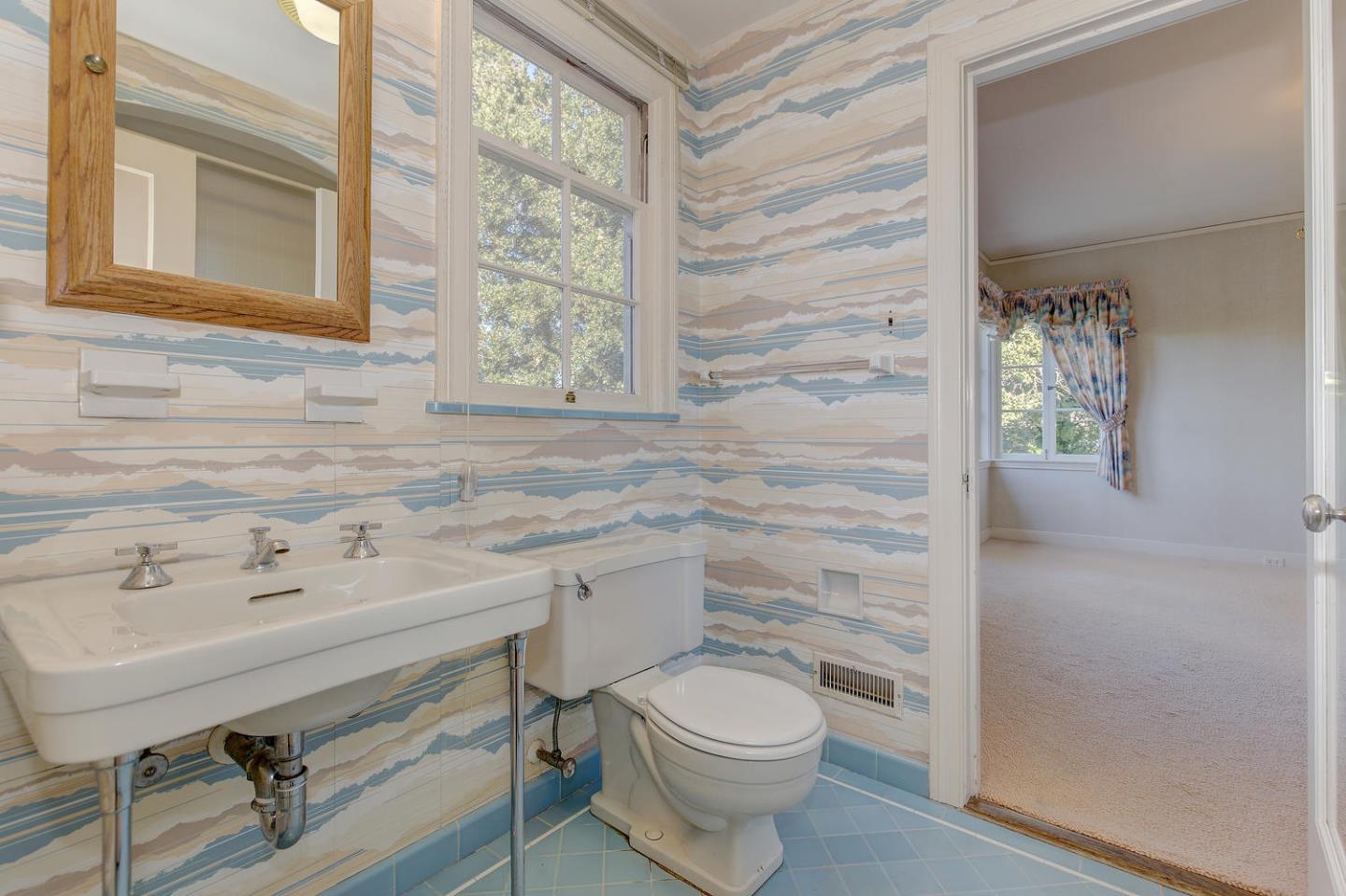 540 Roehampton Road Hillsborough, CA 94010 - Photo 18 of 27 a bathroom with a sink a toilet and vanity