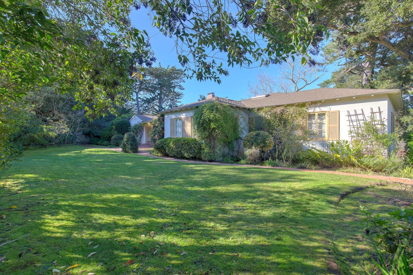 540 Roehampton Road Hillsborough, CA 94010 - Photo 2 of 27 a view of a big yard with plants and large trees