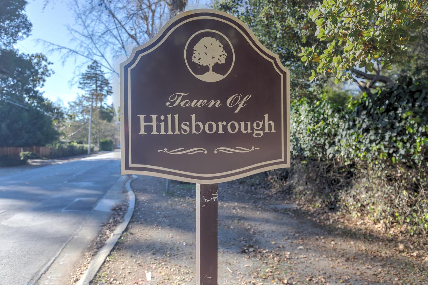 540 Roehampton Road Hillsborough, CA 94010 - Photo 27 of 27 a sign that is sitting on a brick wall