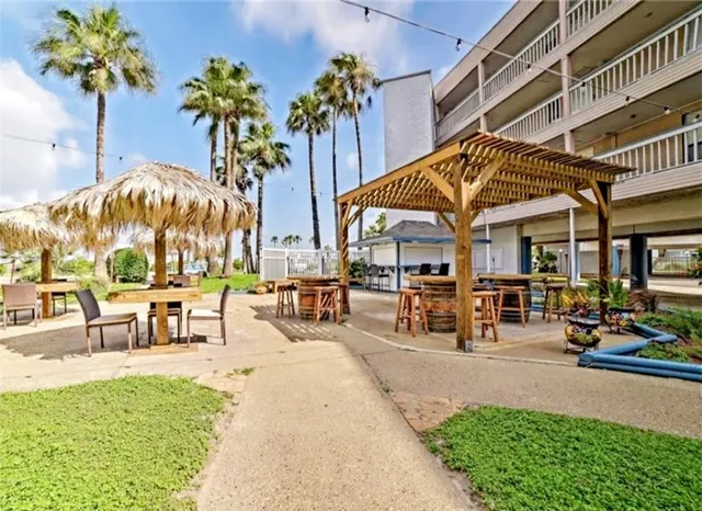 a view of a building with sitting area