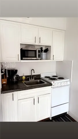 a kitchen with stainless steel appliances a sink and a stove