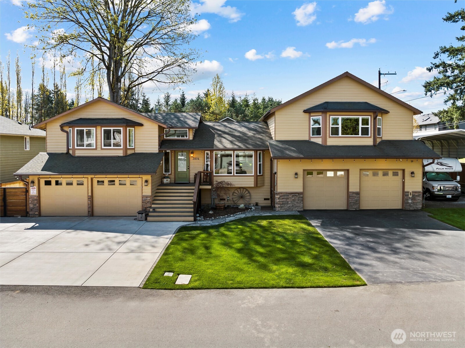3804 199th Street Southeast Bothell, WA 98012 - Photo 1 of 33 a front view of a house with garden