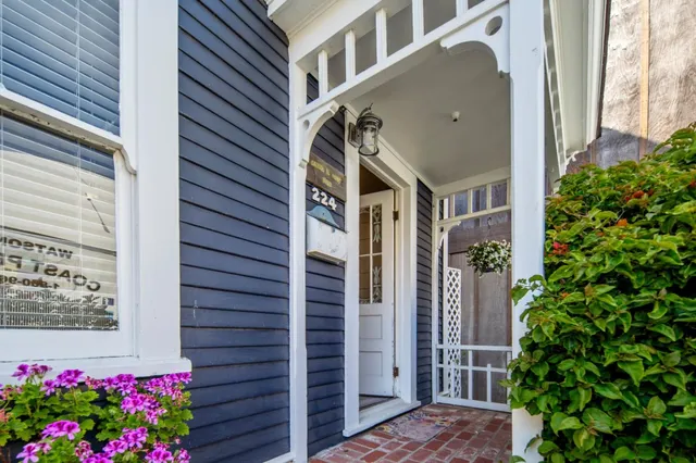 a view of a house with a flower garden