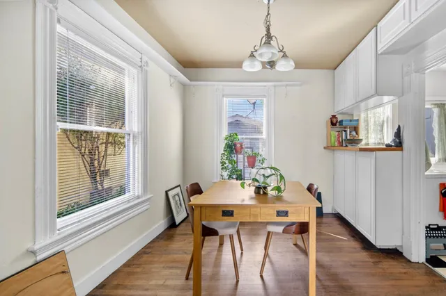 a view of a dining room with furniture window and wooden floor