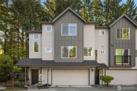 a front view of a house with garage