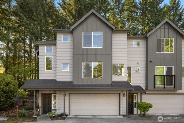 a front view of a house with garage