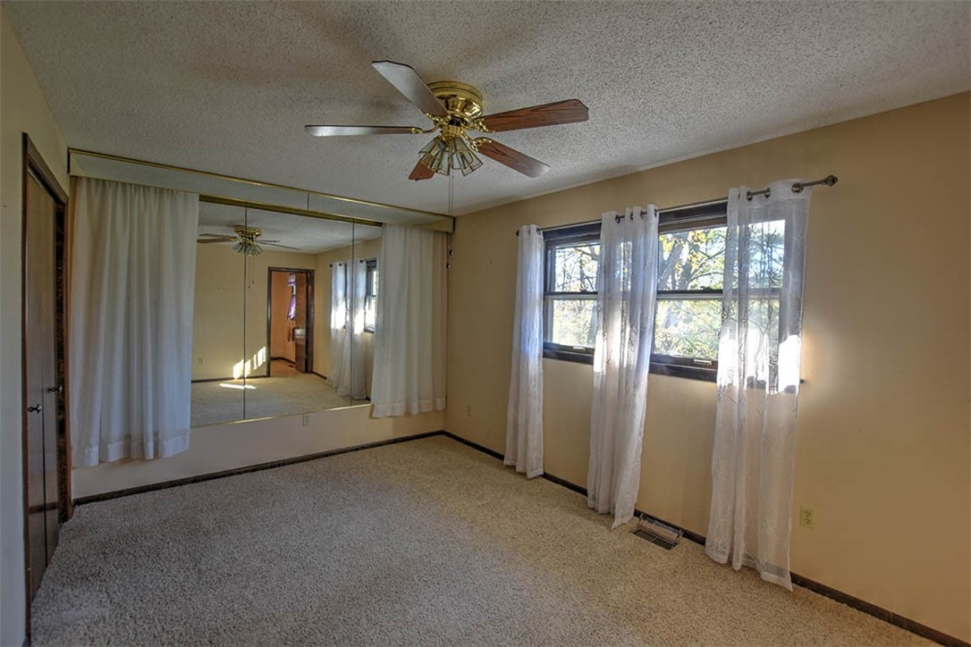 3441 Ferris Drive Decatur, IL 62521 - Photo 14 of 30 a view of a livingroom with a ceiling fan and window