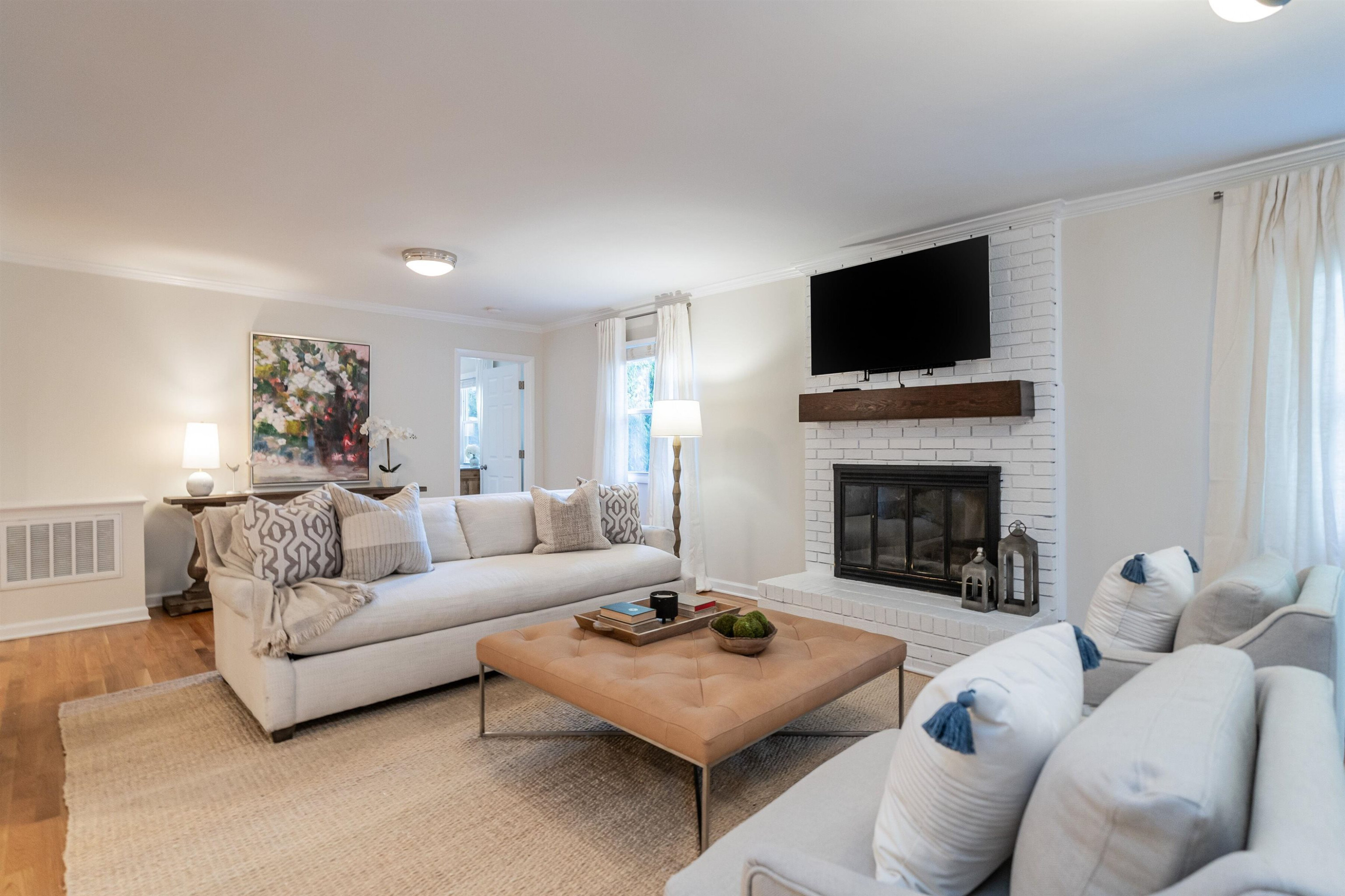 2408 Remington Road Raleigh, NC 27610 - Photo 17 of 31 a living room with furniture a fireplace and a flat screen tv