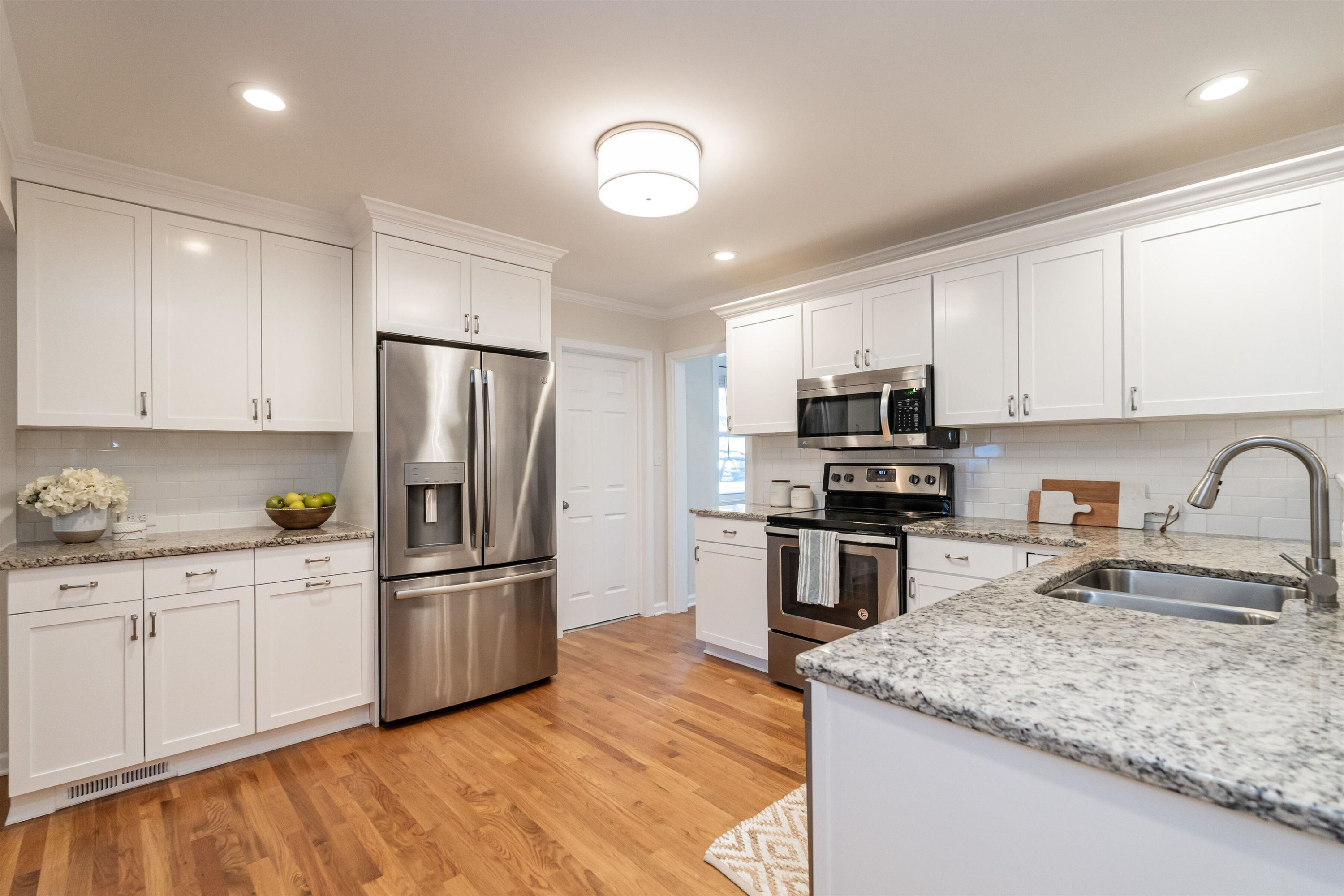 2408 Remington Road Raleigh, NC 27610 - Photo 9 of 31 a kitchen with stainless steel appliances granite countertop a sink stove and refrigerator