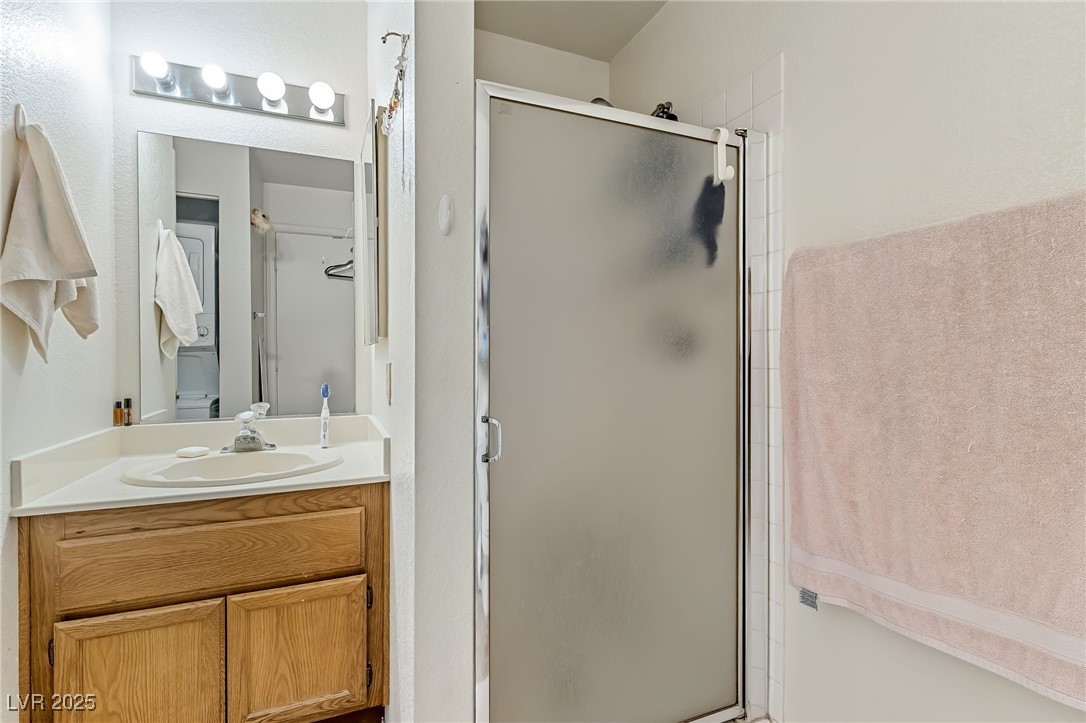 2180 Highpointe Drive, Unit 203 Laughlin, NV 89029 - Photo 17 of 20 Bathroom featuring a stall shower and vanity