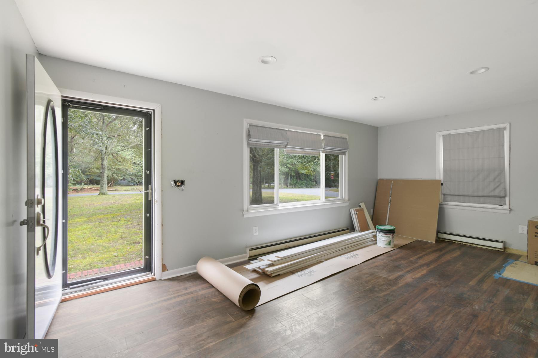 32548 Mt Olive Road Salisbury, MD 21804 - Photo 2 of 16 a living room with a window and a table