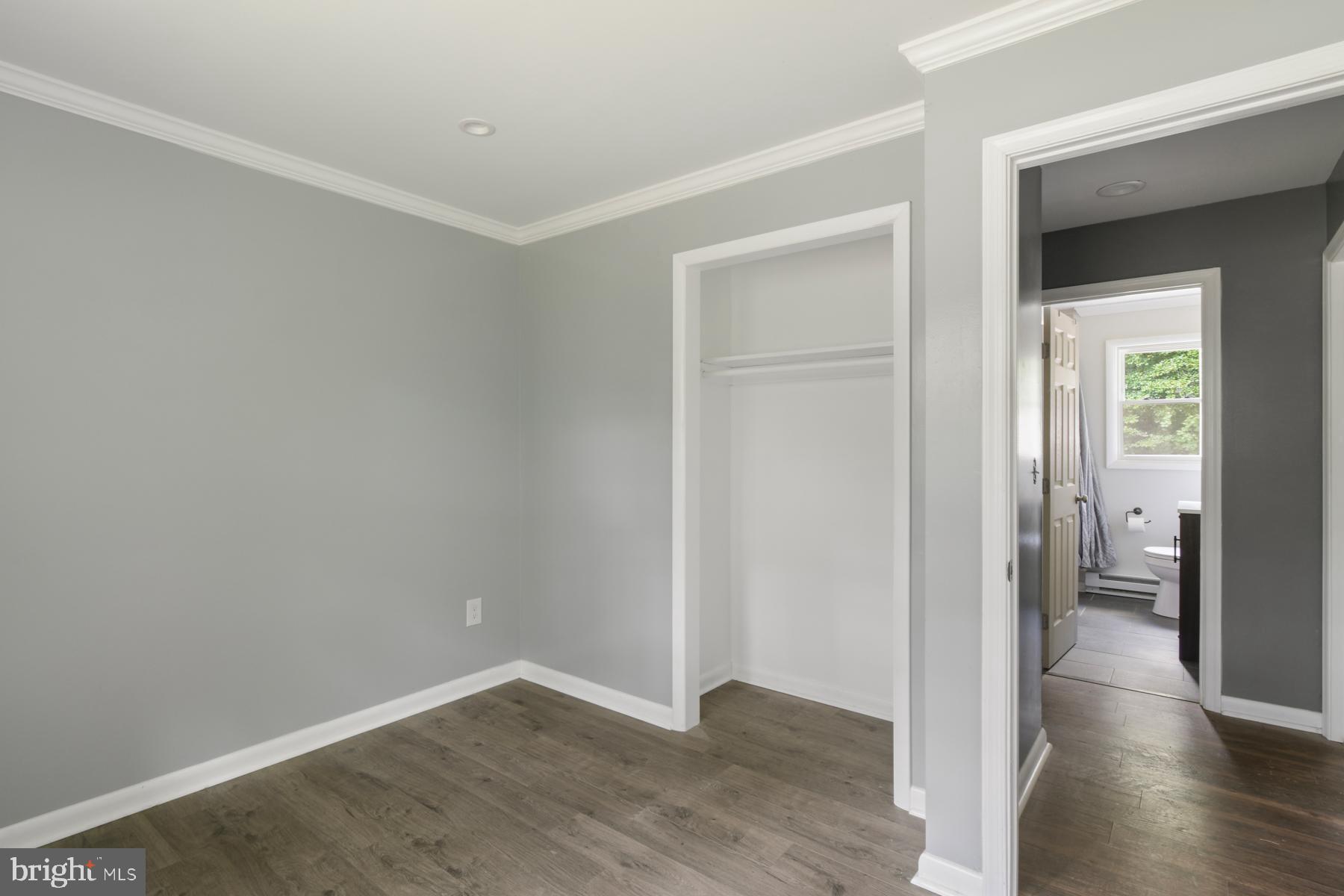 32548 Mt Olive Road Salisbury, MD 21804 - Photo 10 of 16 wooden floor in a hall with an empty room