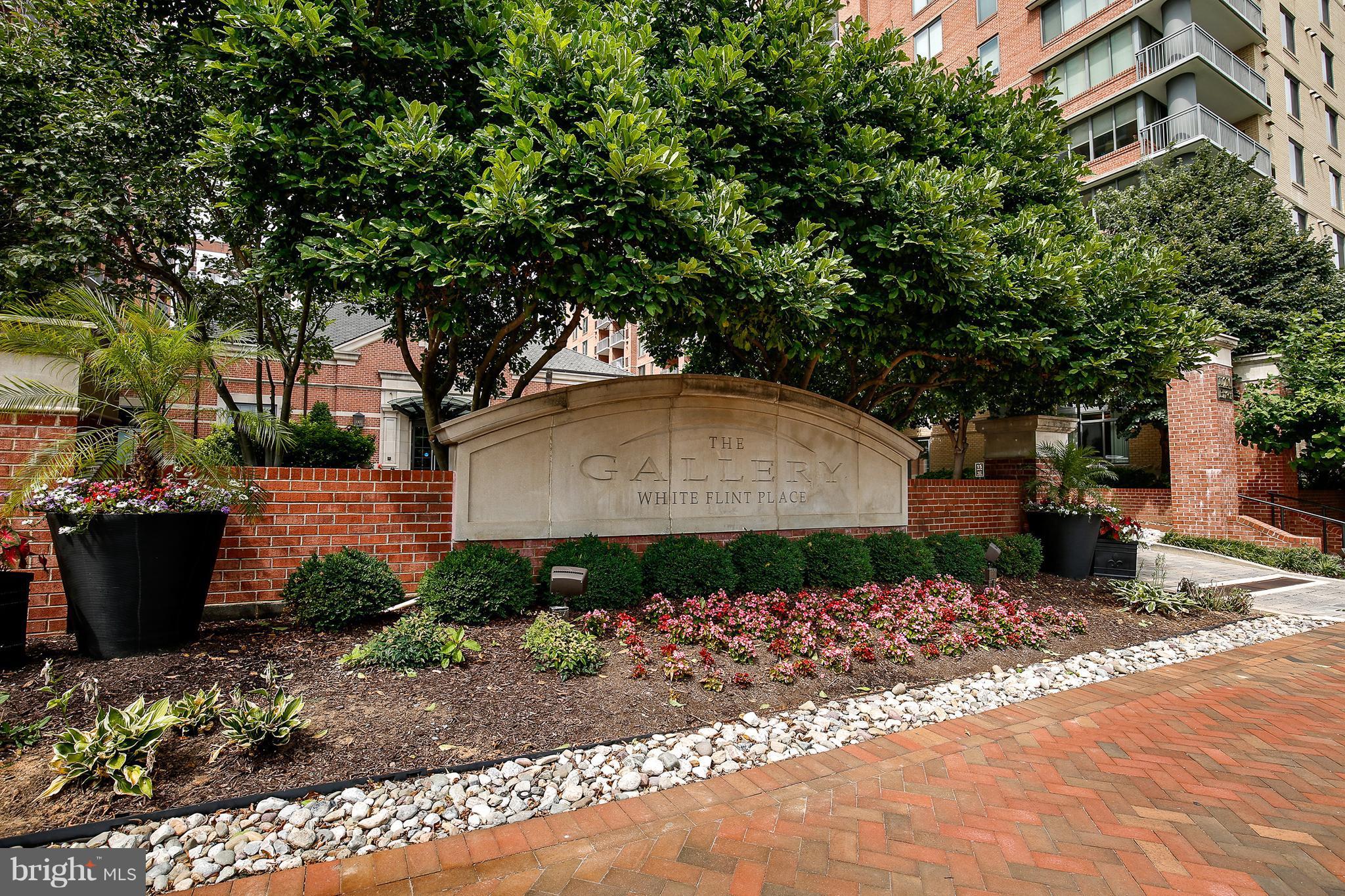 11710 Old Georgetown Road, Unit 1124 North Bethesda, MD 20852 - Photo 1 of 30 a backyard of a house with lots of green space