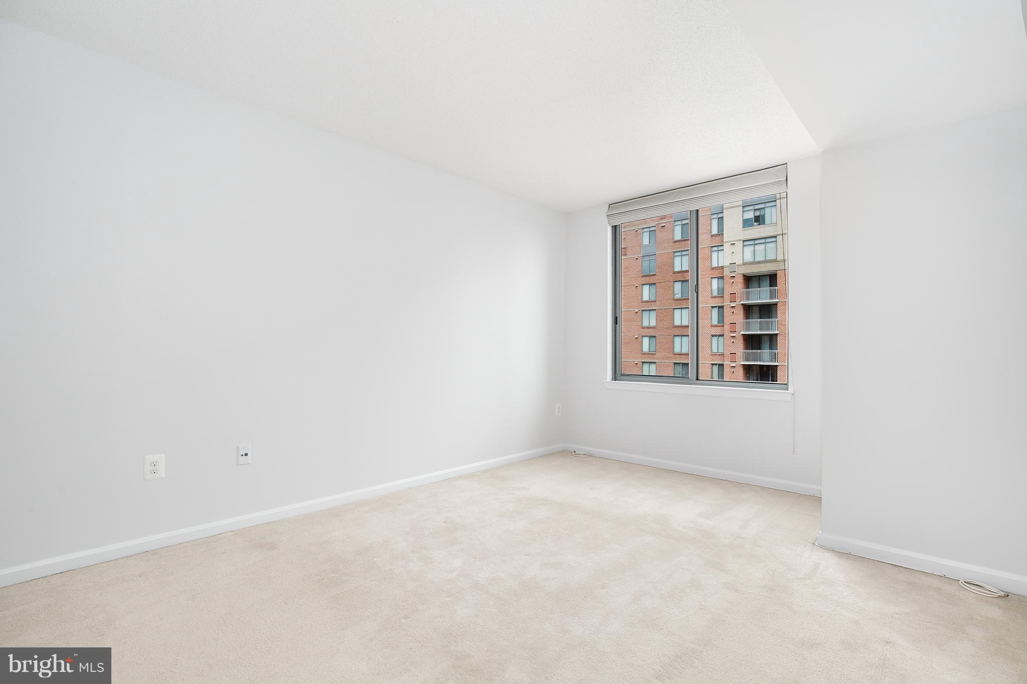 11710 Old Georgetown Road, Unit 1124 North Bethesda, MD 20852 - Photo 12 of 30 an empty room with windows