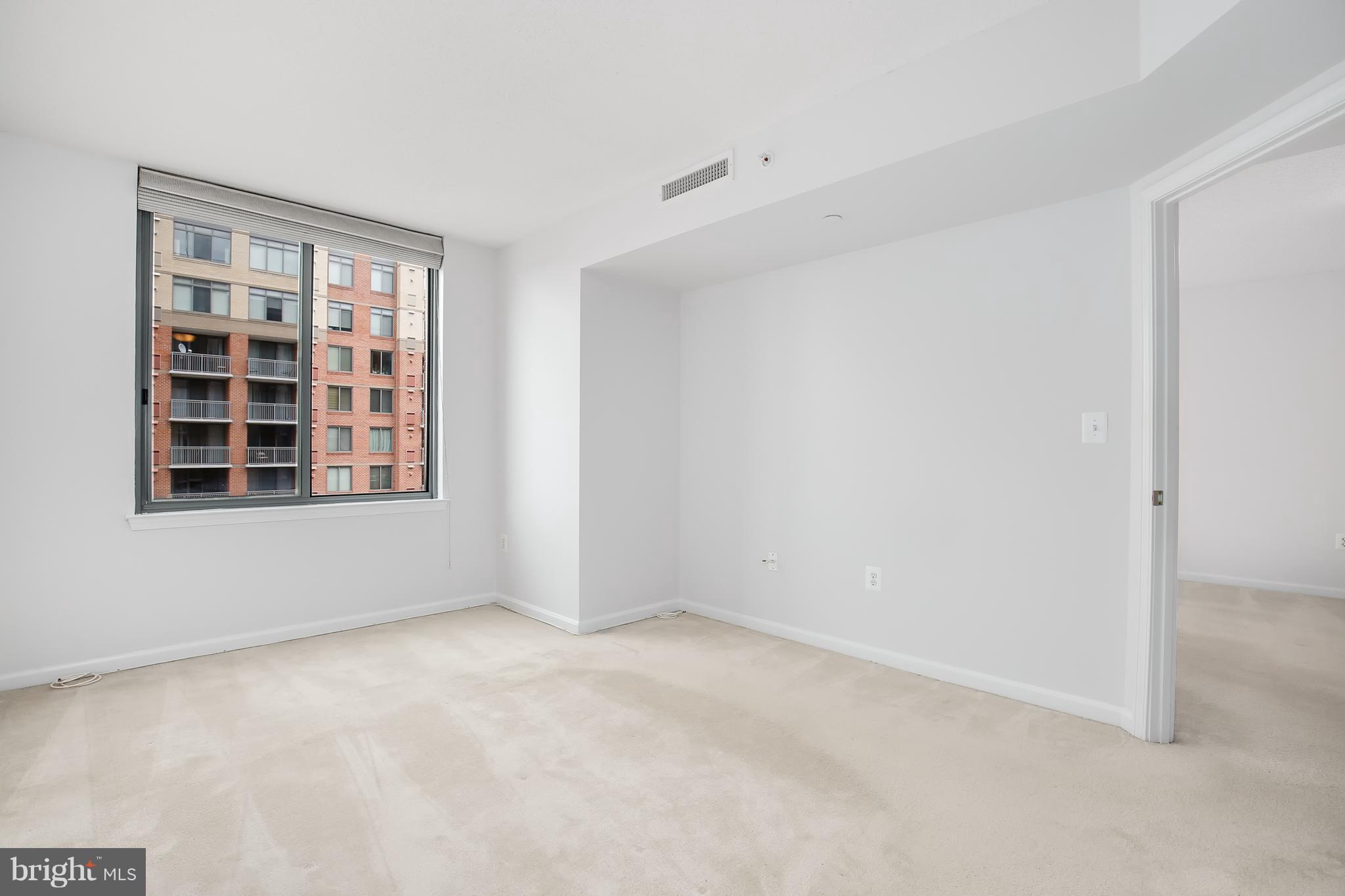 11710 Old Georgetown Road, Unit 1124 North Bethesda, MD 20852 - Photo 13 of 30 a view of an empty room with a window