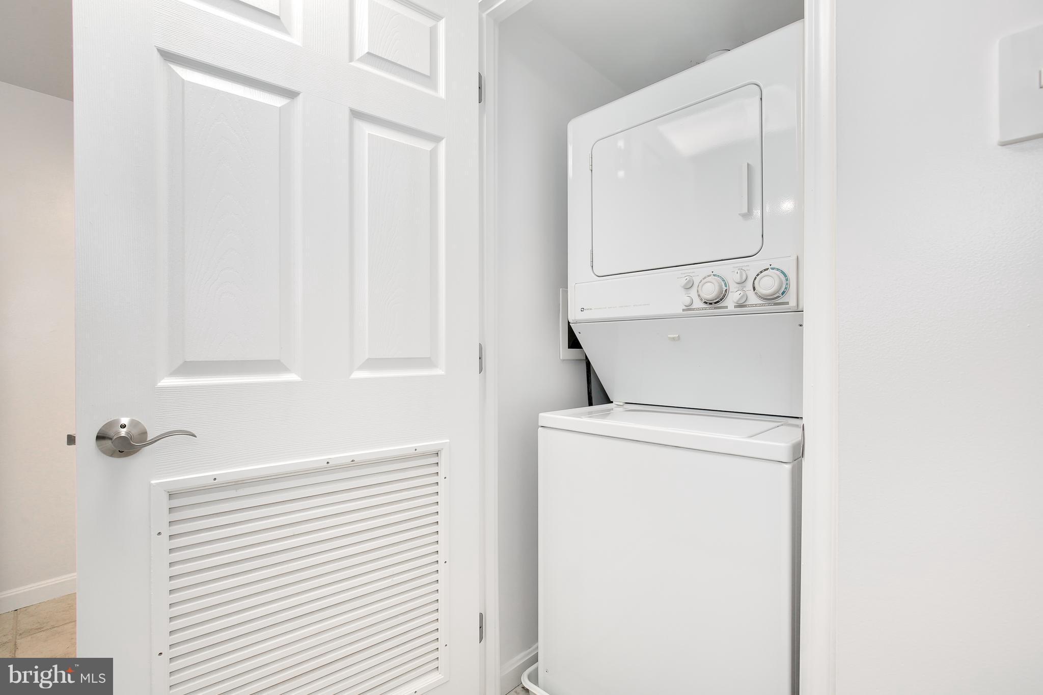 11710 Old Georgetown Road, Unit 1124 North Bethesda, MD 20852 - Photo 6 of 30 a utility room with dryer and washer