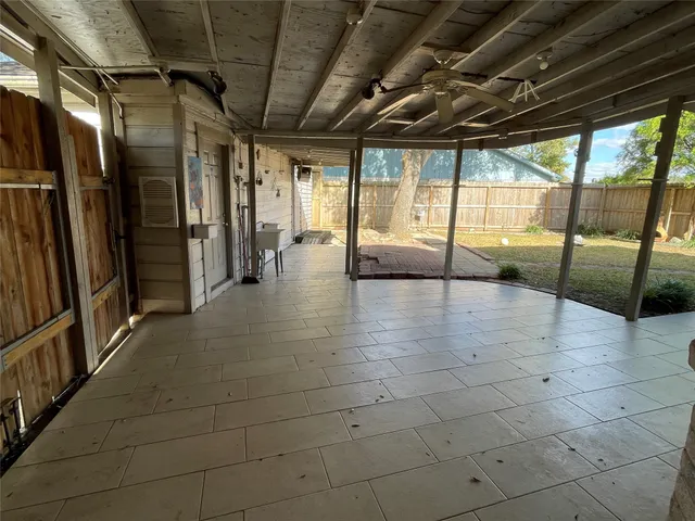 a lobby with furniture and floor to ceiling window