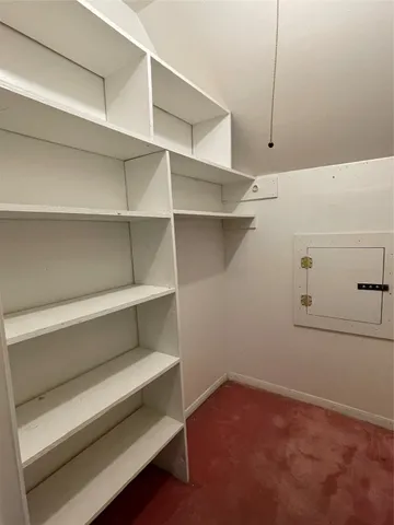 a view of an empty walk in closet