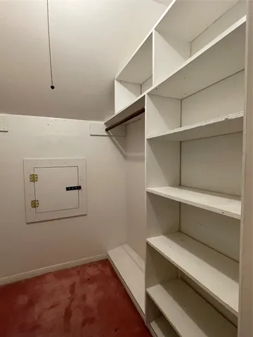 a view of an empty walk in closet