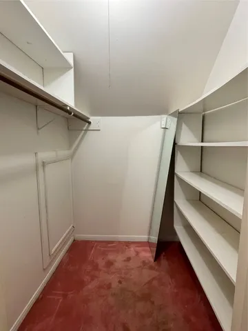a view of an empty walk in closet