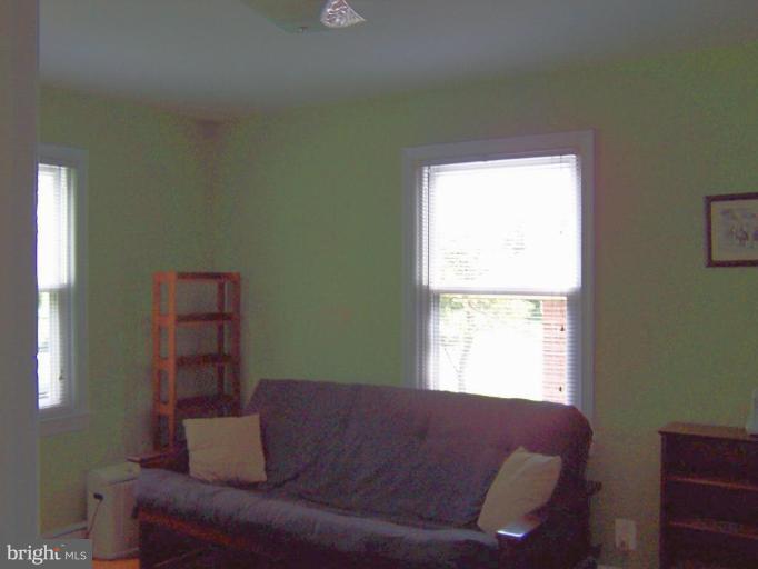 9904 Renfrew Road Silver Spring, MD 20901 - Photo 12 of 15 a living room with furniture and a window