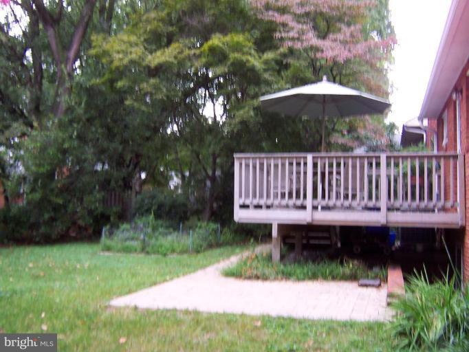 9904 Renfrew Road Silver Spring, MD 20901 - Photo 3 of 15 a view of a backyard with a garden and deck