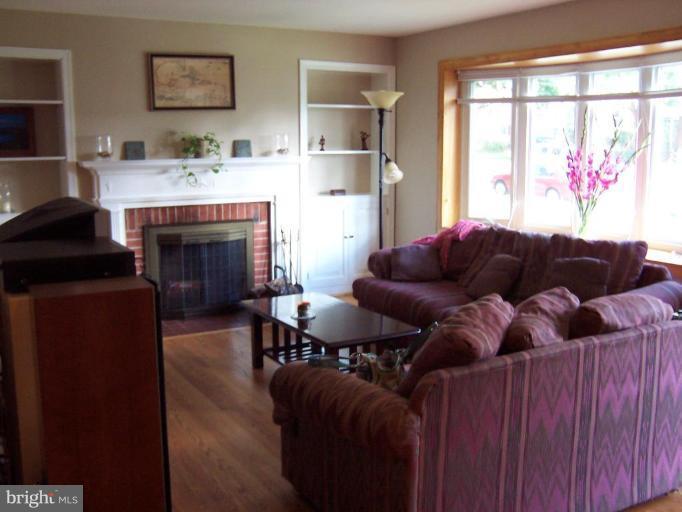9904 Renfrew Road Silver Spring, MD 20901 - Photo 10 of 15 a living room with furniture and a fireplace