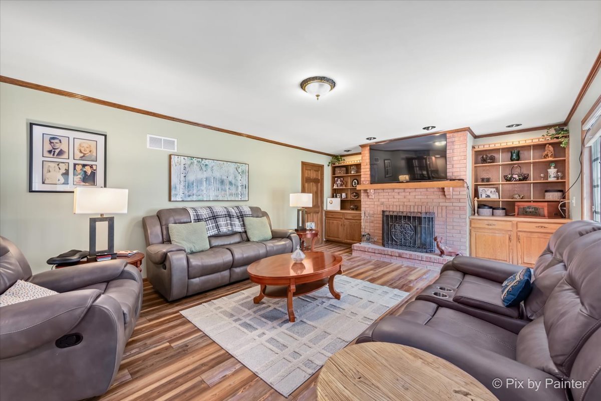 2N445 Beith Road Elburn, IL 60119 - Photo 11 of 58 a living room with furniture fireplace and a large window