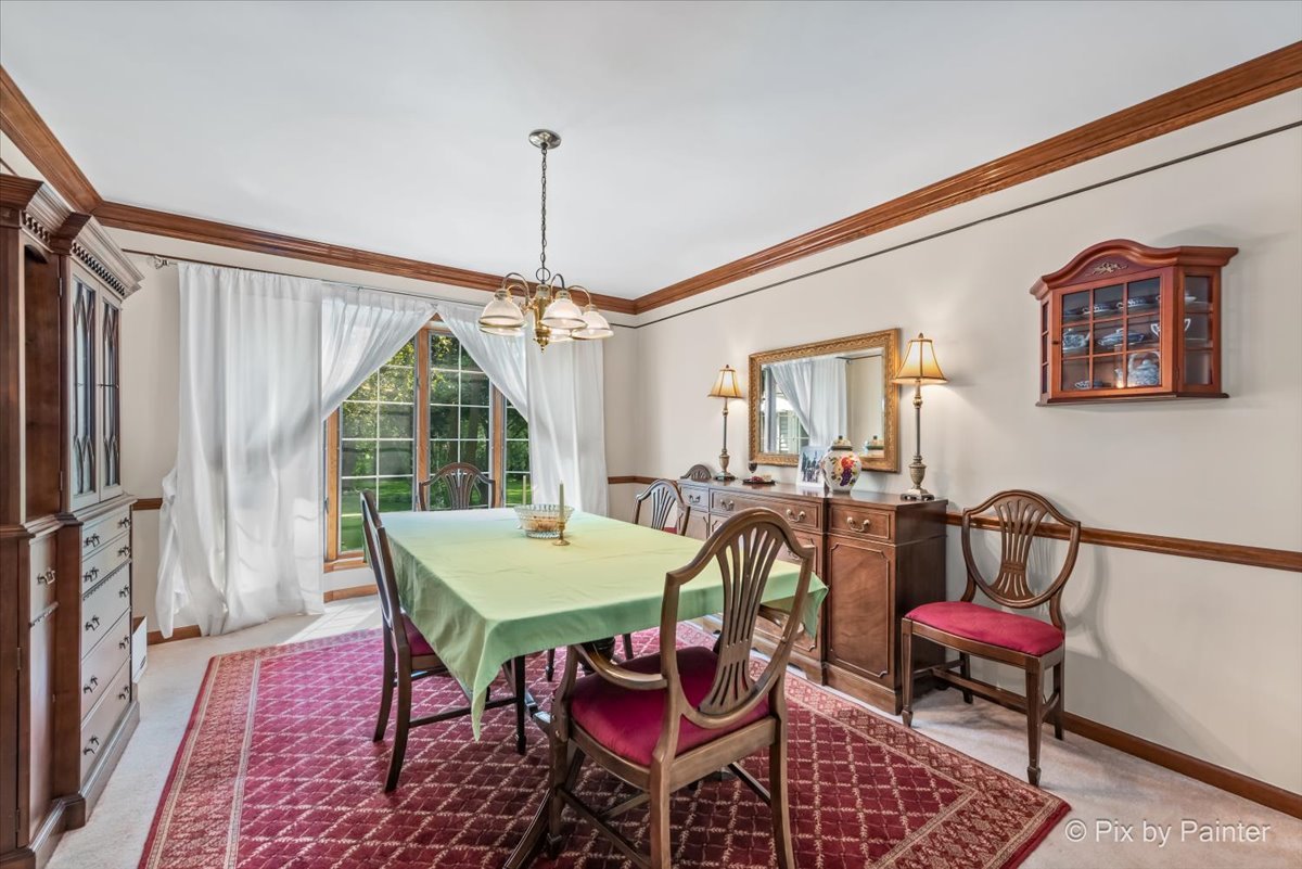 2N445 Beith Road Elburn, IL 60119 - Photo 15 of 58 a view of a dining room with furniture window and wooden floor
