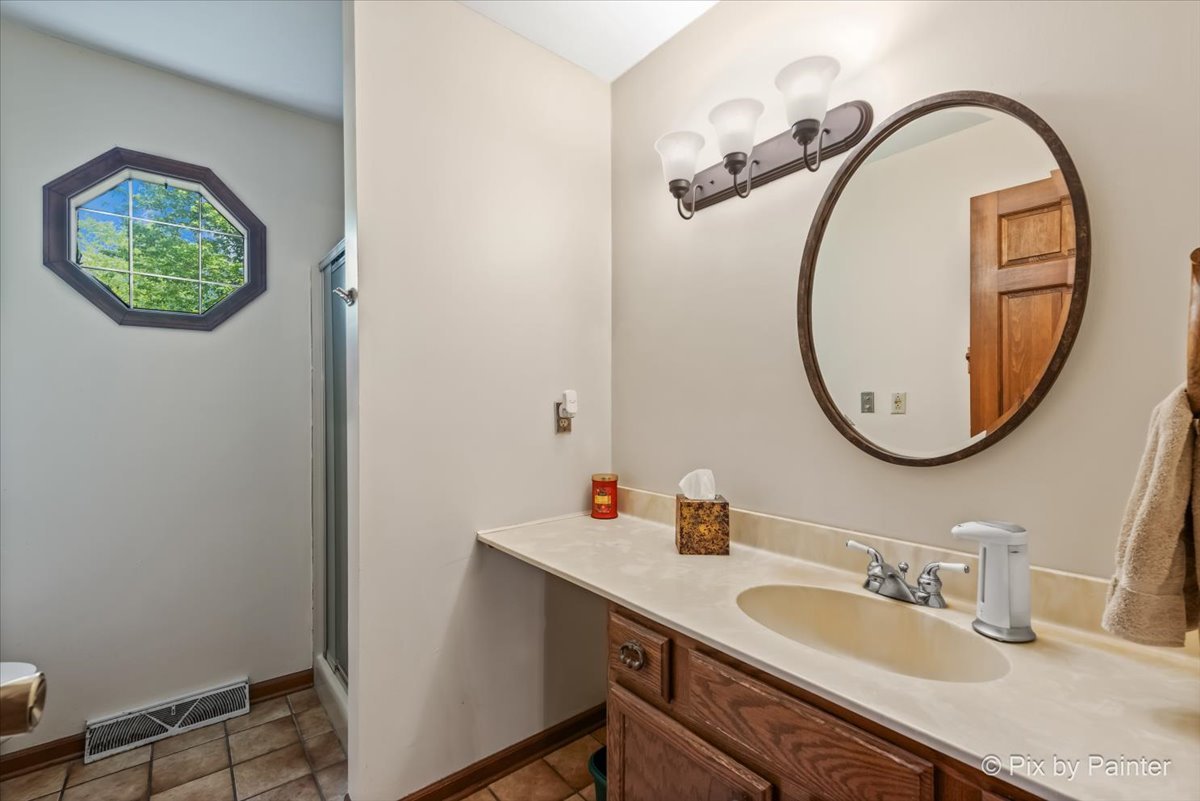 2N445 Beith Road Elburn, IL 60119 - Photo 20 of 58 a bathroom with a sink and a mirror
